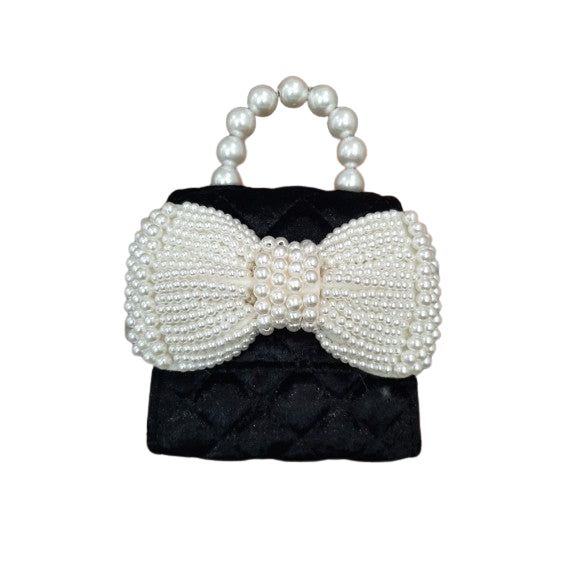 QUILTED VELVET PURSE WITH PEARL BOW